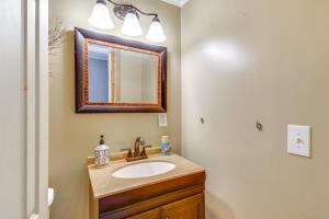 a bathroom with a sink and a mirror at 5 Mi to Lake Ontario Mexico Home with Seasonal Pool in Mexico +24 photos