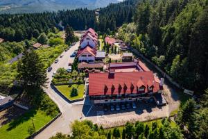 an overhead view of a large building with a red roof at Q Resort and Spa in Săcele