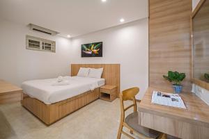 Giường trong phòng chung tại Muong Thanh Luxury Apartment Seaview