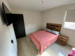 Ένα ή περισσότερα κρεβάτια σε δωμάτιο στο Departamento Piso 2