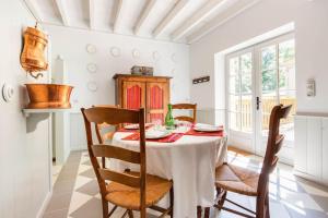 a dining room with a table and chairs at La Mouline in Auterive