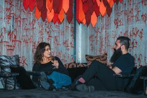 a man and a woman sitting on a couch at Generator Stockholm in Stockholm