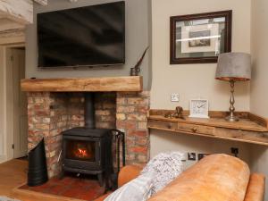 TV a/nebo společenská místnost v ubytování Duckstone Cottage + 16 fotografií