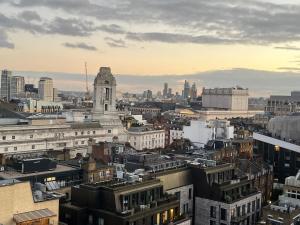 a view of a city with a clock tower at 2 Bed Ap Covent Garden in London