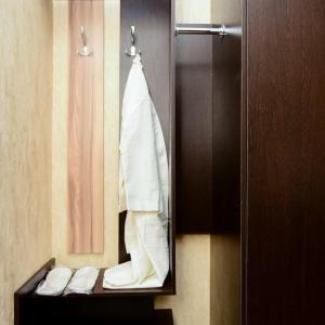 a towel hanging on a towel rack in a bathroom at Alatau Hotel in Astana