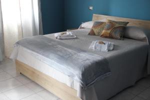 Postel nebo postele na pokoji v ubytování Casa Vacanze Sud e Magia + 37 fotografií