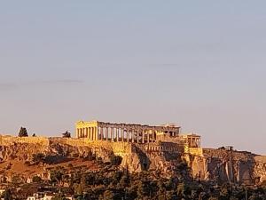 a building on the side of a mountain at Acropolis View Studio in Monastiraki in Athens
