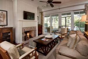 a living room with a couch and a fireplace at Montage 3 Bedroom Wilson Village Home 5001 in Bluffton