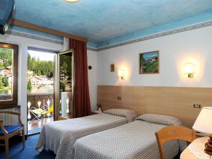 Voodi või voodid majutusasutuse Hotel Adriana toas