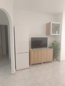 Televízia a/alebo spoločenská miestnosť v ubytovaní Vera Natura Apartamento Maria