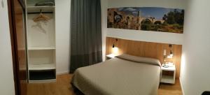 A bed or beds in a room at Hostal Restaurante Cornella