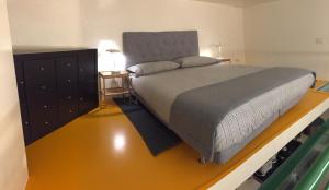 A bed or beds in a room at Duomo House