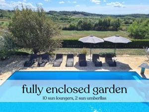a pool with chairs and umbrellas in a yard at Villa Stella - Gourmet Breakfast, Wellness & Pool in Višnjan