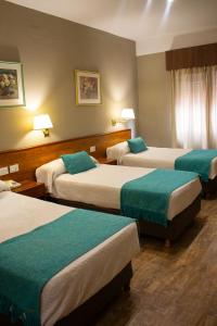Ένα ή περισσότερα κρεβάτια σε δωμάτιο στο Hotel Centro