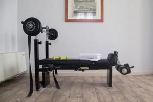 a room with a bench with a gym equipment at Hotel Park in Sottomarina