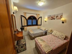 Postel nebo postele na pokoji v ubytování Residencial Sol Suite 2