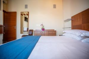 Postel nebo postele na pokoji v ubytování Hotel Coppe Jesolo