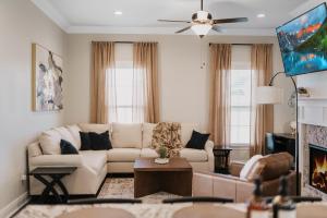 a living room with a couch and a fireplace at Long Term Stay Fast Wifi Comfortable in Lake Charles