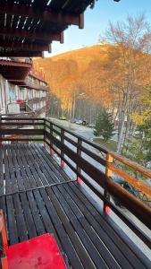 a wooden bench sitting on top of a fence at Home Beta in Terminillo