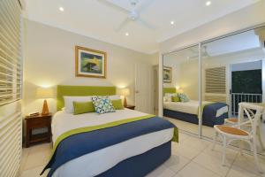 Postel nebo postele na pokoji v ubytování Reef Villa Port Douglas + 9 fotografií