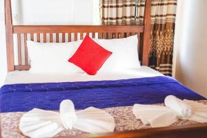 Postel nebo postele na pokoji v ubytování Harmony Beach Resort
