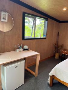 Ένα ή περισσότερα κρεβάτια σε δωμάτιο στο Punga Cabin