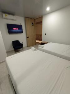 Postel nebo postele na pokoji v ubytování RB Hotel