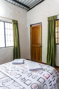 Postel nebo postele na pokoji v ubytování Casa Rivera Del Castillo