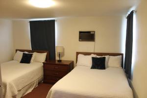 Postel nebo postele na pokoji v ubytování Sprague Motel