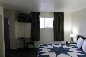 Postel nebo postele na pokoji v ubytování Sprague Motel
