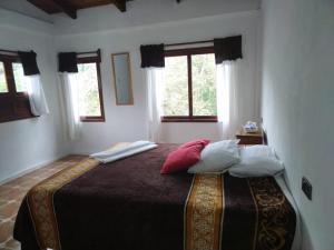 Postel nebo postele na pokoji v ubytování Hotel Coyopolan
