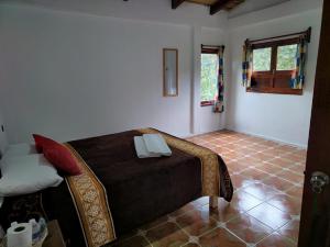 Postel nebo postele na pokoji v ubytování Hotel Coyopolan