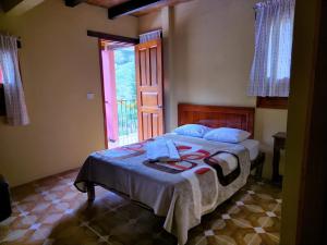 Postel nebo postele na pokoji v ubytování Hotel Coyopolan