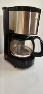 a coffee maker with a pot on top of it at Casa de Temporada Centro de Uberaba in Uberaba