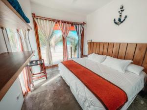 Postel nebo postele na pokoji v ubytování Mi Playa Galapagos Beachfront + 37 fotografií