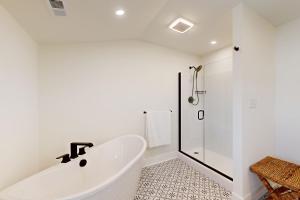 a white bathroom with a tub and a shower at South Bethany --- 106 Brandywine Drive in Bethany Beach +20 photos
