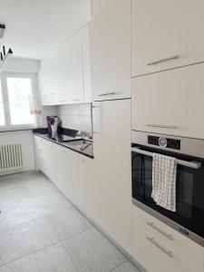 Kuchyň nebo kuchyňský kout v ubytování Apartment Snowball, Modern, cosy, Matterhorn views