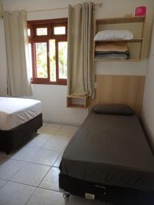 Postel nebo postele na pokoji v ubytování Casa Canal Barra da Lagoa