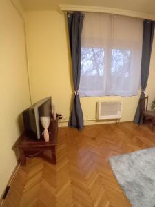 A bed or beds in a room at Mozaik Apartman