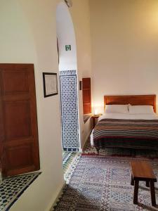 Postel nebo postele na pokoji v ubytování Riad Inspira