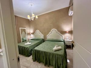 Postel nebo postele na pokoji v ubytování Boutique Hotel Calais Milano