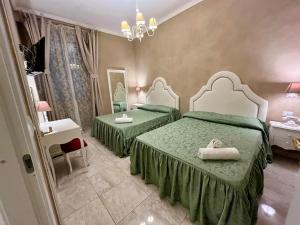 Postel nebo postele na pokoji v ubytování Boutique Hotel Calais Milano