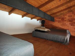 En eller flere senge i et værelse på Chalé Vista pra Lombada