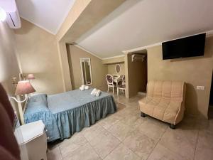 TV a/nebo společenská místnost v ubytování Boutique Hotel Calais Milano