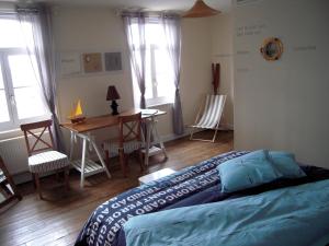 En eller flere senge i et værelse på Bed&B La Ferme De L'ostrevent