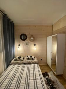 a bedroom with a bed in a room at Połoninka Pokoje in Ustrzyki Górne
