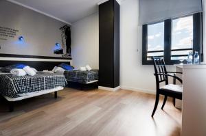 Ένα ή περισσότερα κρεβάτια σε δωμάτιο στο Hotel LB Villa De Cuenca