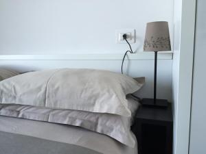 Postel nebo postele na pokoji v ubytování Residence La Nave