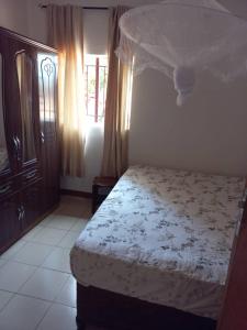 Ένα ή περισσότερα κρεβάτια σε δωμάτιο στο Kaz Villa