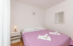 Łóżko lub łóżka w pokoju w obiekcie Apartment Blazenka